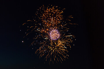 Festive colorful fireworks in the night sky, celebration and holiday concept