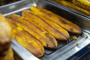 Honey bananas are famous in the old Tangerang market. served with milk chocolate and grated cheese on top.