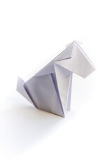 Paper dog origami isolated on a white background