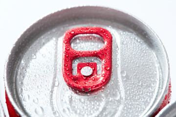 close up of a soda can Condensation, water drops red pull tab on white background