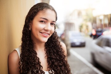 latin american young woman smiling with brackets over street city.