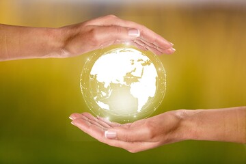 Protecting concept, hand holds a globe