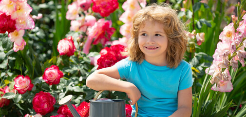 Kid with watering can, spring banner. Child watering a plant with watering can.