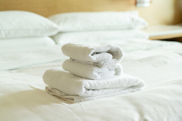 Fototapeta na wymiar close-up white towel on bed