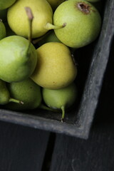 Ripe juicy pears in a vintage box.