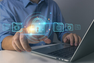 Cyber security concept.Businessman protecting personal data on laptop and virtual interfaces icon.data protection and secured internet access, cybersecurity, Business, technology and networking.