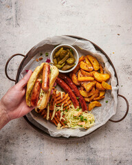 Hot dog, coleslaw and potatoes