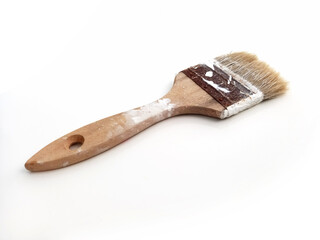 Paint brush isolated on white background. Close up of Painter's brush with traces of paint. Aerial view of used flat brush or palette. DIY and Decoration,