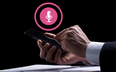 Business person recording the conversation  withmobile phone