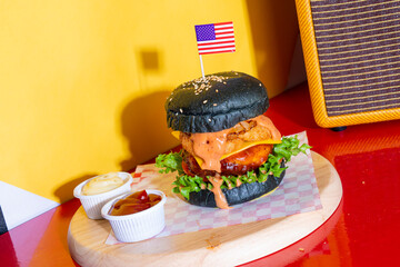 barbecue burger - pork with barbecue sauce with cheese, onion rings and bacon burger