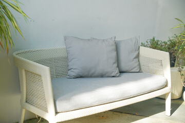 comfortable pillows on wicker chair