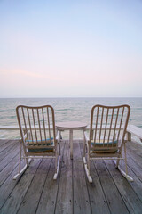 empty chair on balcony with sea background