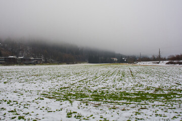The foggy winter landscape near Ossiacher See Lake in Carinthia, Austria. Located in the southern Nock Mountain range of the Gurktal Alps near Villach
