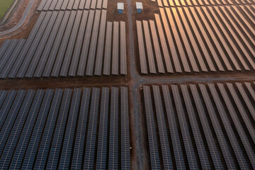 Obraz na płótnie Canvas Solar Photovoltaic of aerial top view, solar plant rows array of ground mount system Installation 