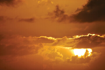 A view of a beautiful orange sunset.