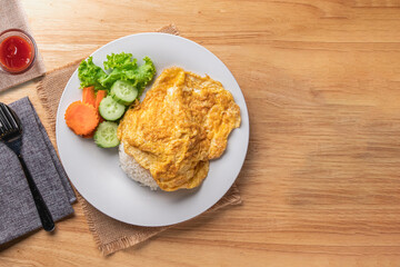Thai style pork omelette with rice, copy space.