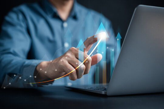 Businessman hands touching business target arrows growing increase to set up business objective target goal, marketing solution, target for business investment.