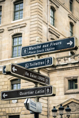 Directional signpost to Parisian landmarks in central Paris. Street sign in Paris. Ile Saint Louis. Quartier Latin
