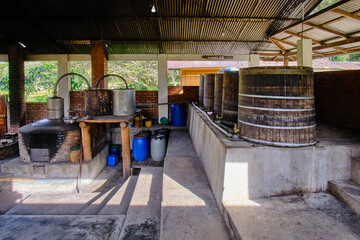 Fototapeta na wymiar Part of the traditional process of distilling brandy from sugar cane, a process that still occurs in many places.