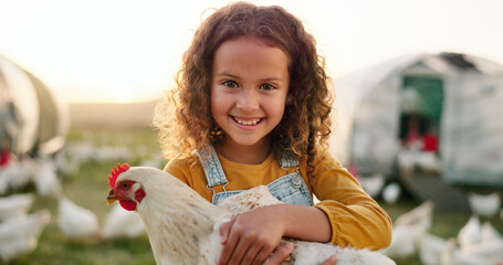 Chicken, smile and girl on a farm learning about agriculture in the countryside of Argentina....