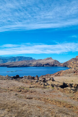 Beautiful red cliffs and mountains on the island of Madeira. Volcanic rocks.