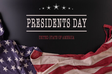 Happy presidents day concept with flag of the United States on dark background for top view concept