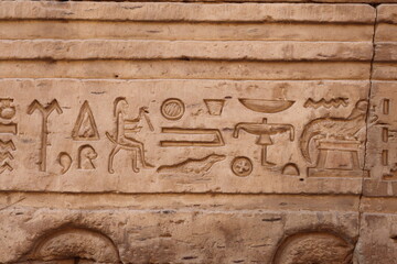 Ancient egyptian hieroglyphs at the walls of Kom Ombo in Aswan, Egypt 