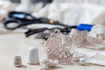 Two thimbles stand on white background close-up..