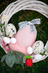 Easter wreath of vines and colored eggs background. Festive decor. Spring holiday decoration. Decorated colorful ster egg. Wreath of branches willow twigs. © Real_life