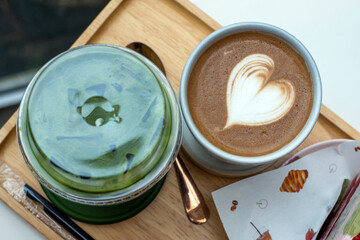Coffee and latte art on wooden tray, stock photo
