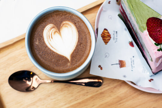 Coffee and latte art on wooden tray, stock photo