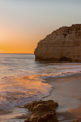 Sunset at the beach near village Carvoeiro, Algarve, Portugal.