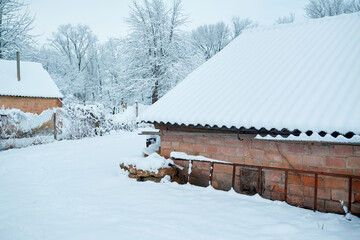 Rural house under the snow, February