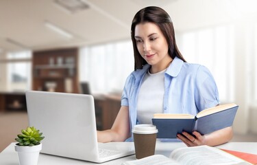 Fototapeta premium Serious young businesswoman sitting at work in office