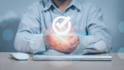 businessmen  hand Show quality assurance symbols with icons. , The concept of certification...