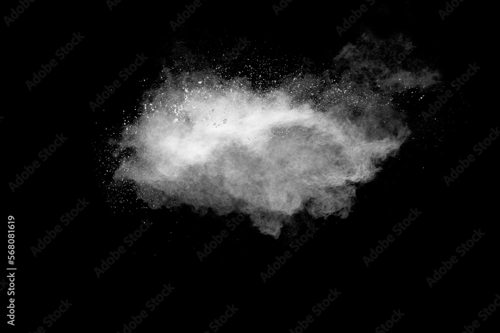 Wall mural white powder explosion cloud against black background.white dust particle splash.