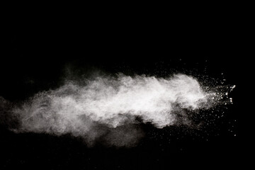 Fototapeta na wymiar White powder explosion cloud against black background.White dust particle splash.