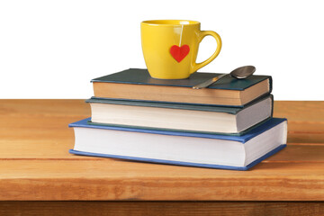 Vintage stack books and cup with heart shape