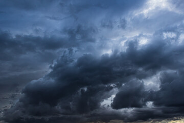 Naklejka na ściany i meble Dark ominous storm clouds create ethereal textured background element 
