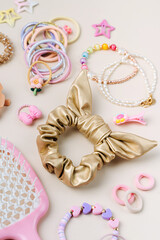 Set of baby girl hair accessories. Fashion hair bows, hair clips, hairpins and hair elastics.  Hairstyles for girls with stylish accessory.