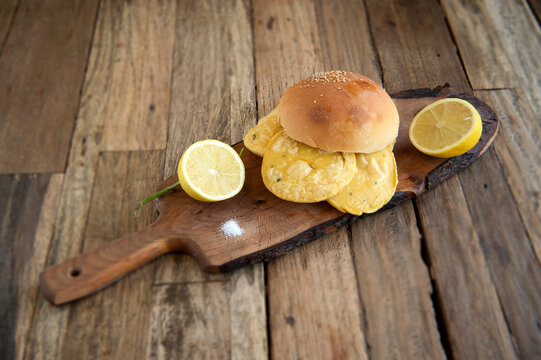 Typical food from Sicily Region Italy called Pane e Panelle on wooden background