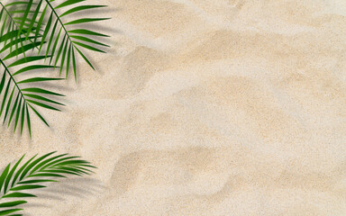 Fototapeta na wymiar Palm leaves over sand beach top view well free space for text present summertime season background 
