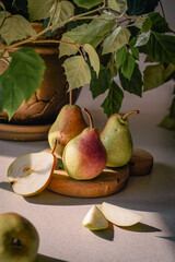 pears on a plate are on the table