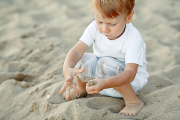 child playing with sand