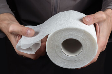 Close-up of in Hand using a toilet paper.