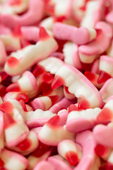 Colored jelly marmalade in the form of teeth, sweet dessert, close up.