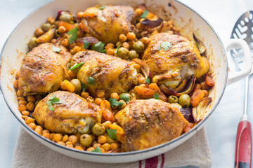 Chicken tagine casserole with olives, preserved lemons and chickpeas  - 568092271