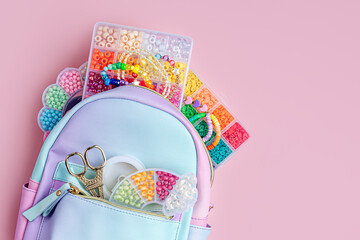 Fashion backpack with beads and boxes for children's needlework and crafts. Kids stuff and ...
