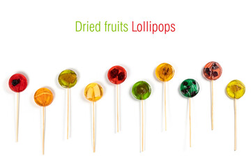 Lollipops with dry fruits inside on a white background. Healthy sweetness, benefits of natural fruits. Collection