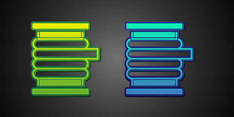 Green and blue Wire electric cable on a reel or drum icon isolated on black background. Vector
